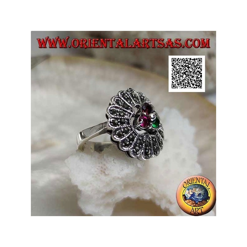 Silver flower ring with trio of central ruby and emerald colored zircons and long marcasite petals