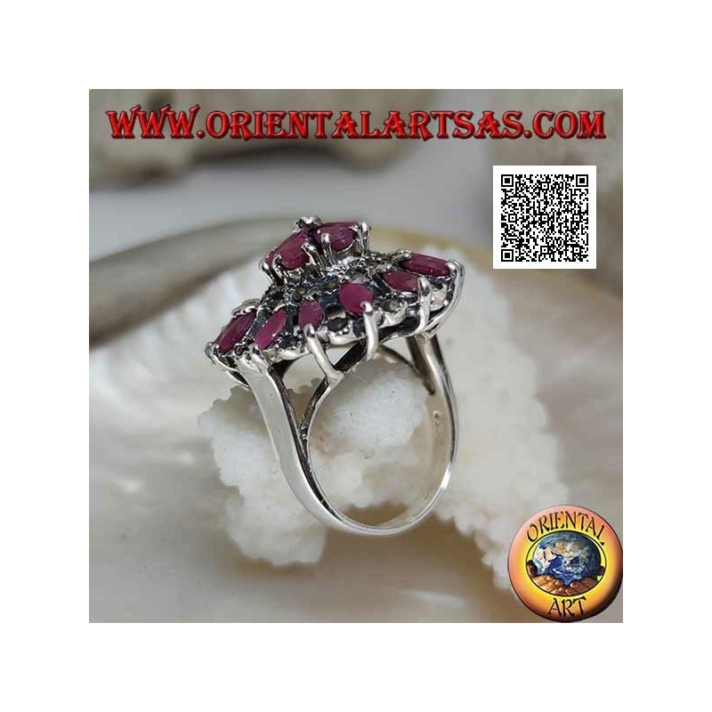 Silver ring in the shape of a large rose window with natural shuttle rubies and marcasite alternating in circles