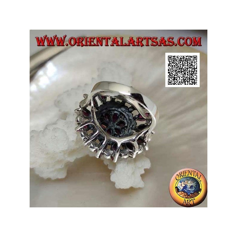 Silver ring in the shape of a large rose window with natural shuttle rubies and marcasite alternating in circles
