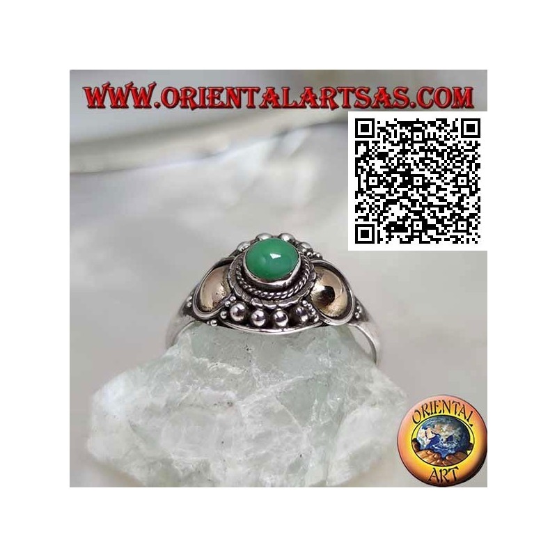 Silver ring with a jade sphere and gold plates on the sides