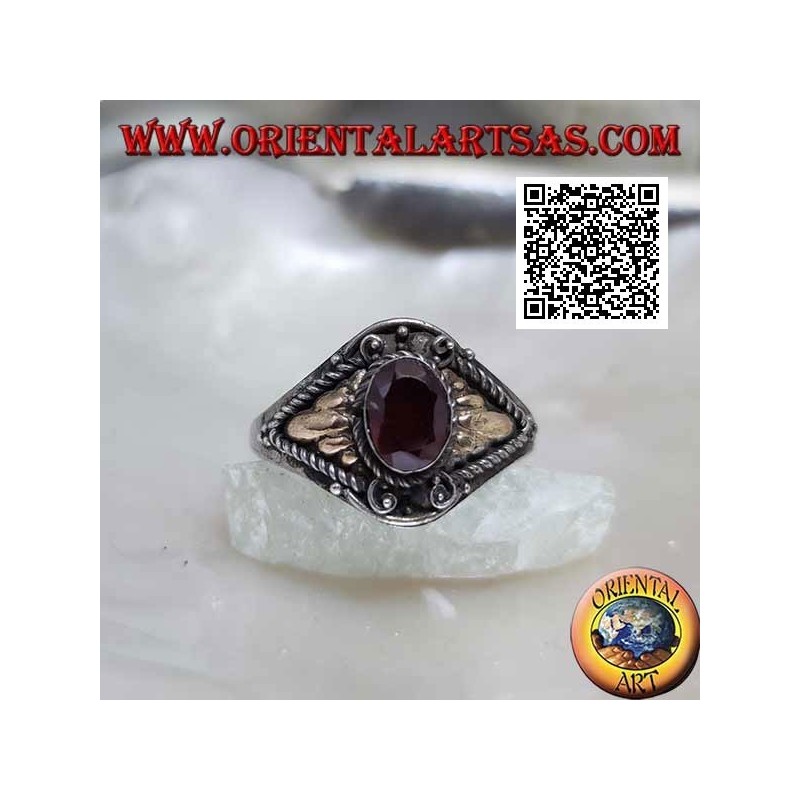 Silver ring with oval garnet and triangular cords with gold plate