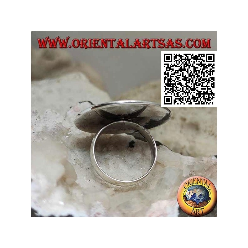 Silver ring with hollow onyx moon on a large smooth round plate