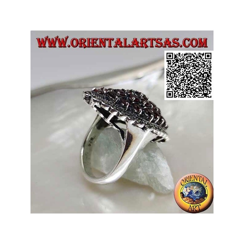 Silver ring in the shape of a rhombus composed of round garnets set and a marcasite frame