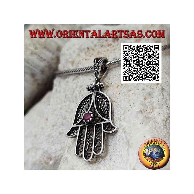 Silver pendant Hand of Fatima with perforated ethnic decoration and set ruby-colored zircon (oxidized)