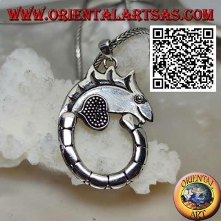 Silver pendant in the shape of a chameleon with a long circle tail