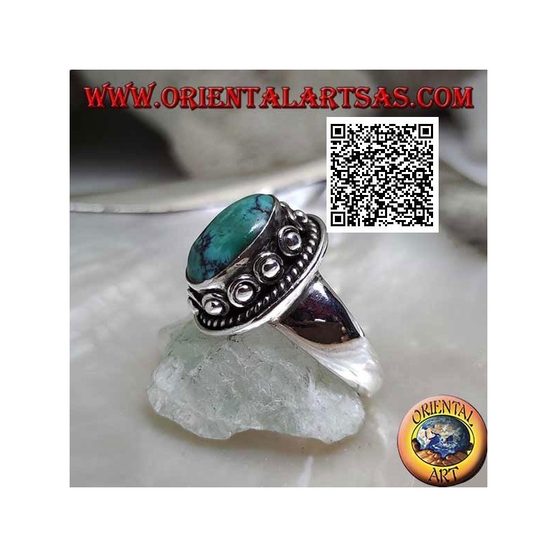 Anillo de plata con turquesa tibetana ovalada antigua rodeada de entretejido y bola en la rosquilla