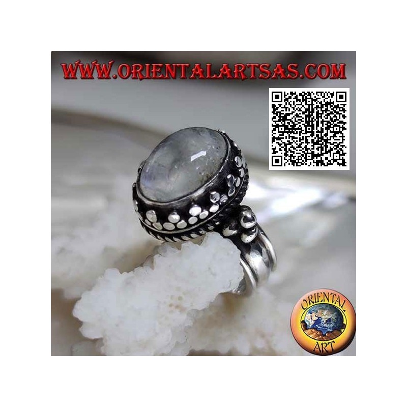 Silver ring with oval rainbow moonstone with tris rim and balls and intertwining