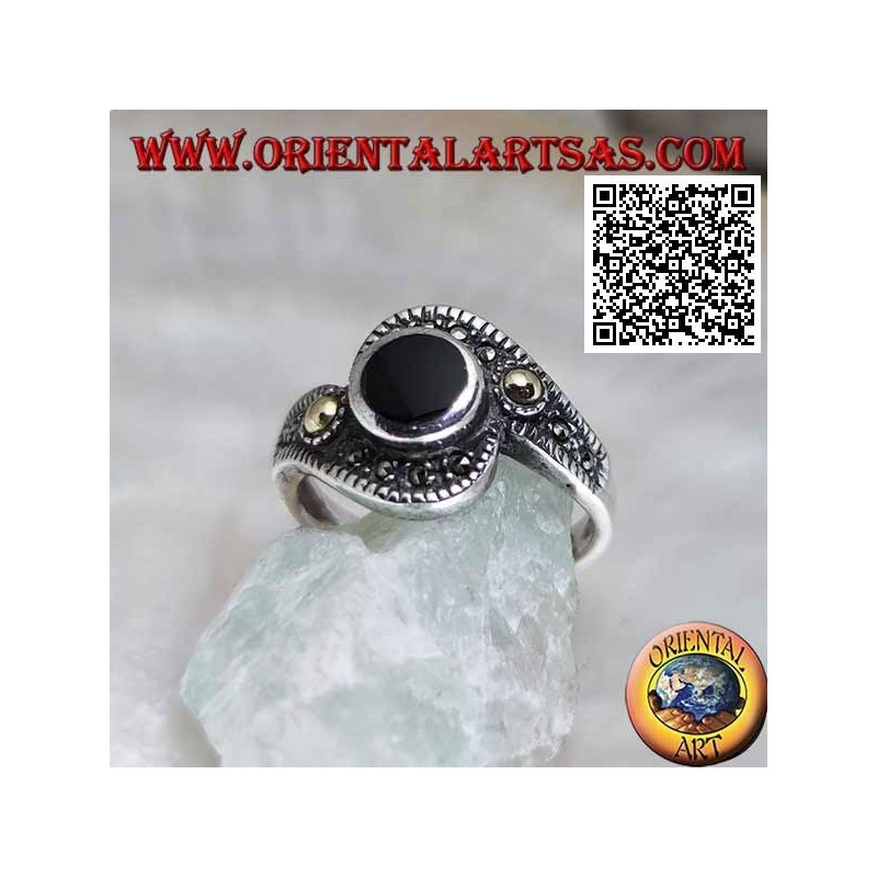 Silver ring with round onyx wrapped in a marcasite band with a gold-plated ball on the sides