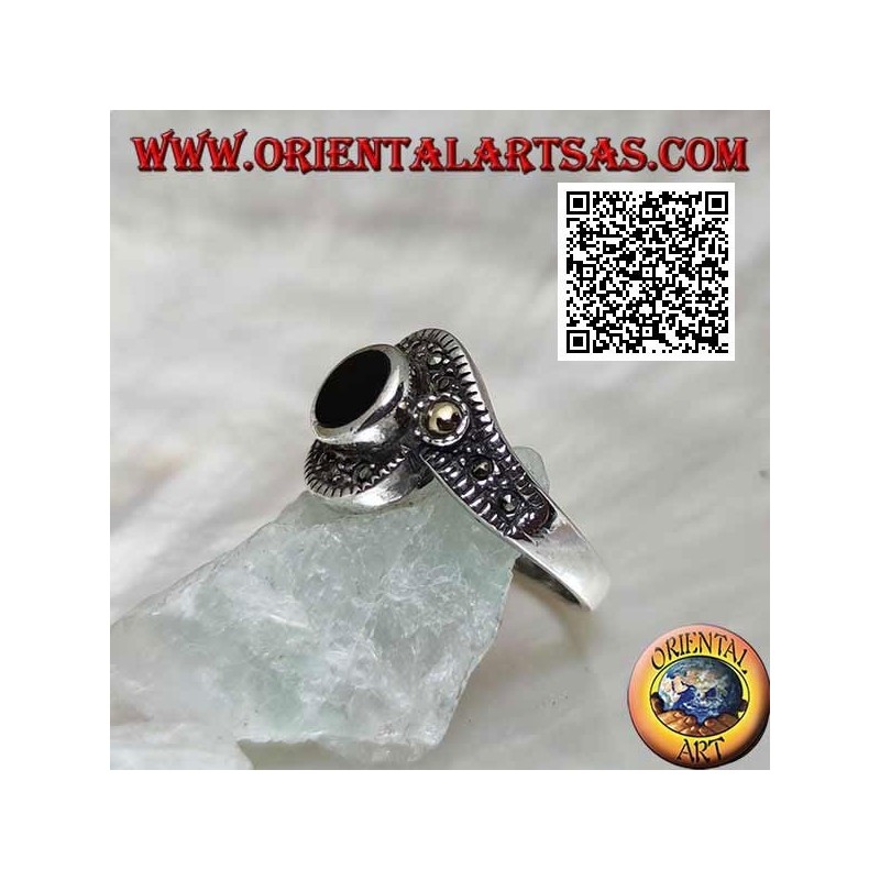 Silver ring with round onyx wrapped in a marcasite band with a gold-plated ball on the sides