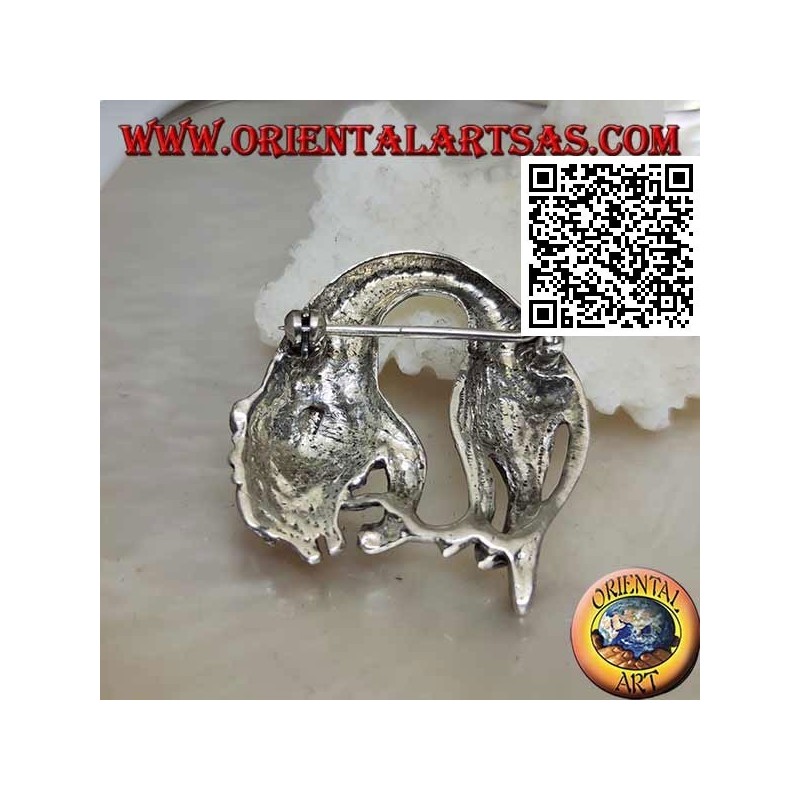 Silver brooch, lion (king of the forest) folded while feeding