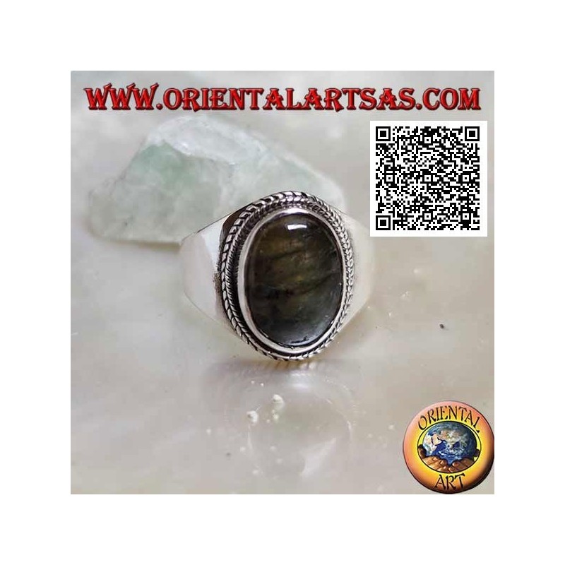 Silver band ring with oval labradorite surrounded by interweaving on a smooth setting