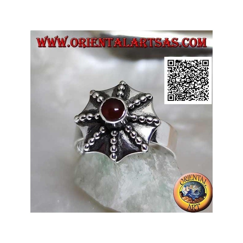 Silver ring in the shape of a pagoda umbrella with central round carnelian