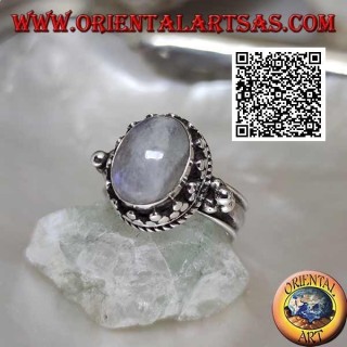 Silver ring with oval rainbow moonstone surrounded by trio of discs and intertwining