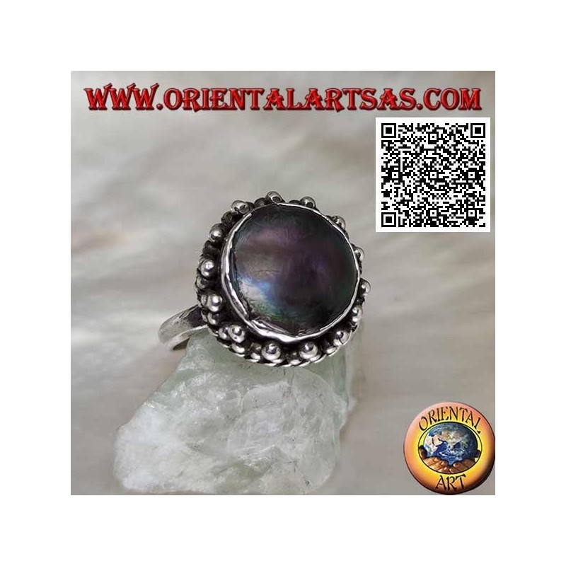 Silver ring with round abalone paua shell surrounded by interweaving and trio of balls