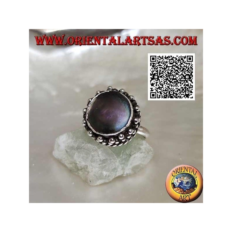 Silver ring with round abalone paua shell surrounded by interweaving and trio of balls