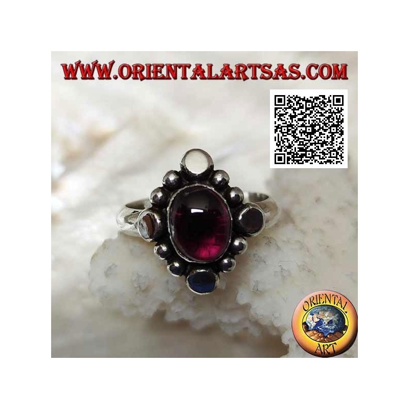 Silver ring with oval cabochon garnet surrounded by alternating studs and balls