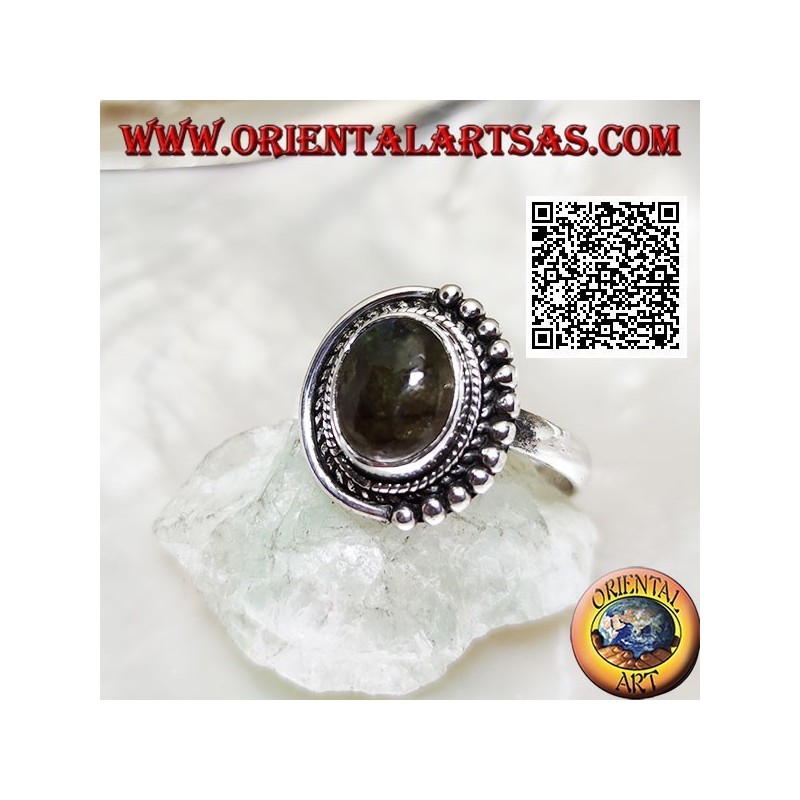 Silver ring with oval labradorite surrounded by intertwining and balls only on one half