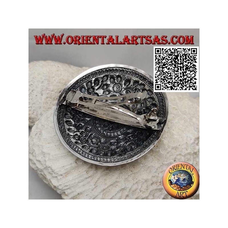 Silver chiseled shield with floral decoration with central flower (metal clip closure)