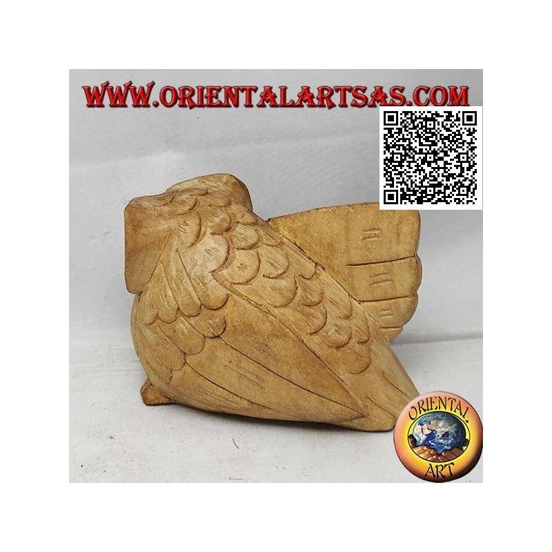 Sculpture of a three-quarter owl with an outstretched wing in hibiscus wood