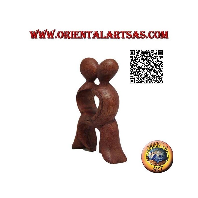 Sculpture of the kiss of a couple with intersected legs in suar wood of 10 cm