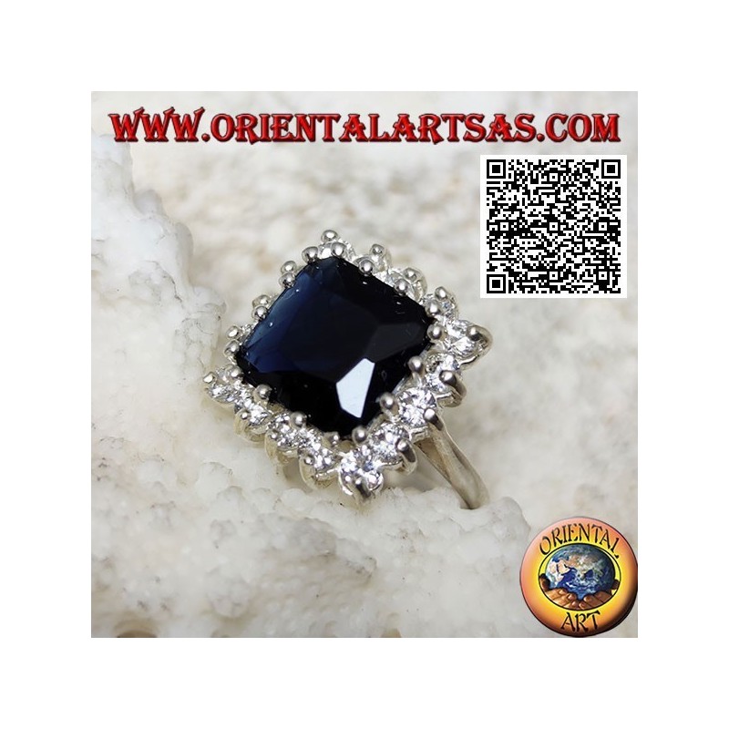 Silver ring with faceted square synthetic sapphire set surrounded by white zircons