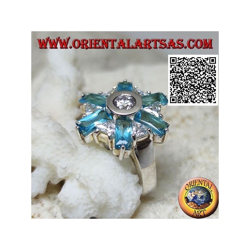 Silver ring with six petals of blue topaz and alternating central white zircons