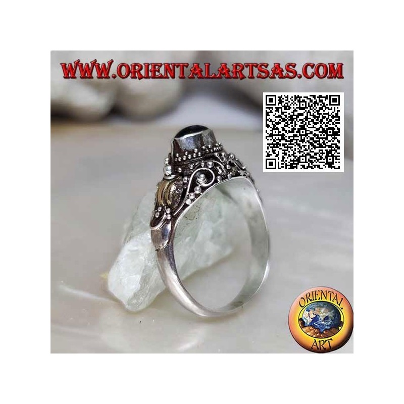 Silver ring with a raised horizontal oval onyx on ethnic setting with 14 carat gold leaves