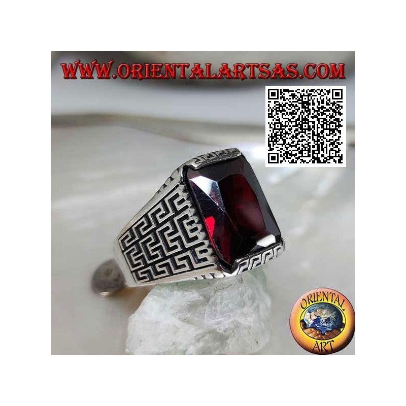 Silver ring with faceted rectangular garnet and geometric labyrinth engraved on the sides