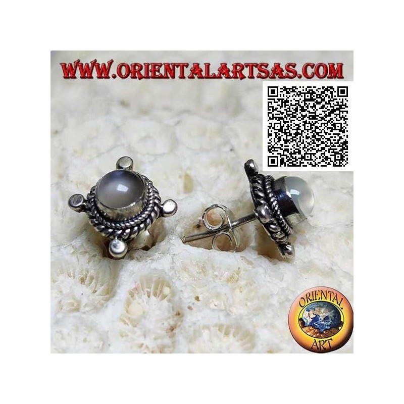 Silver earrings with round moonstone surrounded by interweaving and disks on the cardinal points