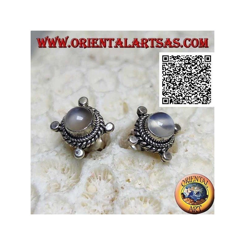 Silver earrings with round moonstone surrounded by interweaving and disks on the cardinal points