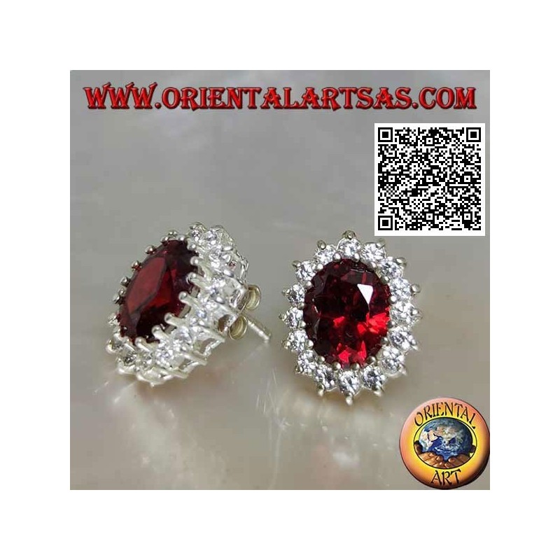Silver lobe earrings with oval faceted garnet surrounded by white zircons