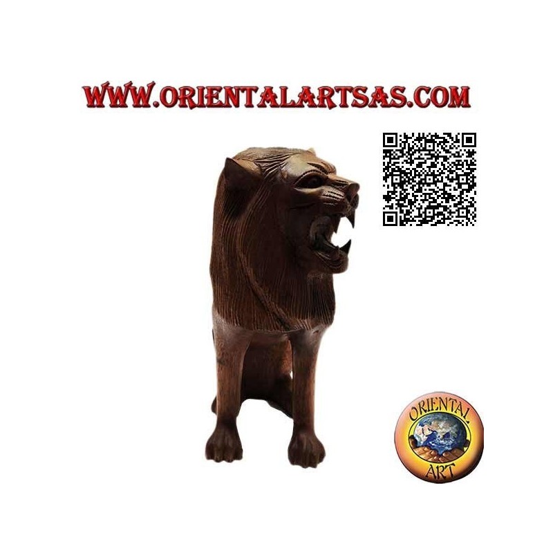 Sculpture of a seated lion hand carved from a single 25 cm block of suar wood