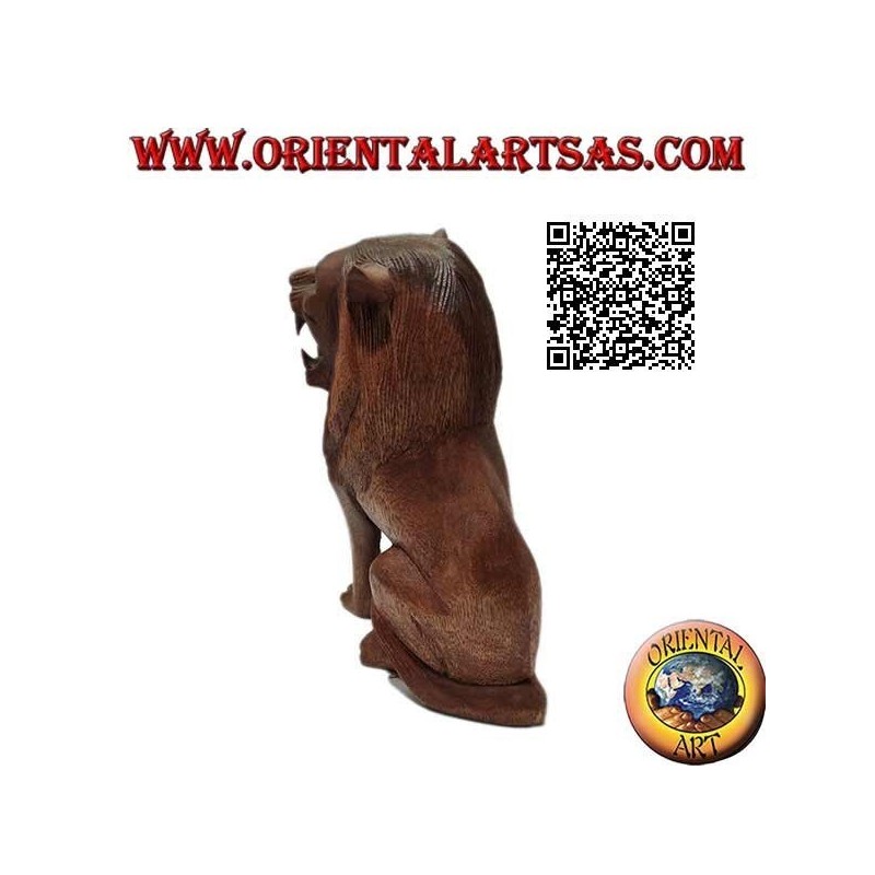 Sculpture of a seated lion hand carved from a single 25 cm block of suar wood