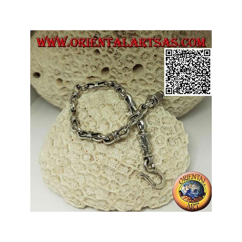 Soft silver chain bracelet with alternating rings and narrow ovals in the center and engraved clasp