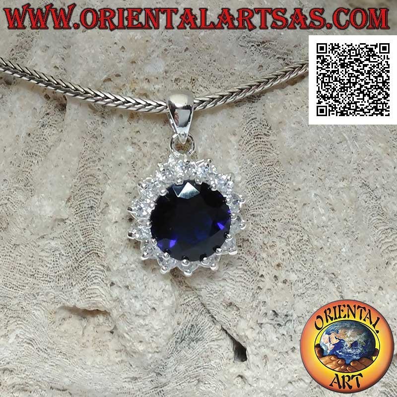 Silver pendant with round synthetic sapphire set surrounded by white zircons