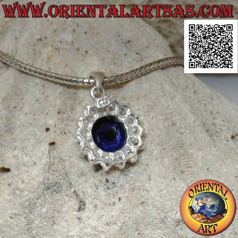Silver pendant with round synthetic sapphire set surrounded by white zircons