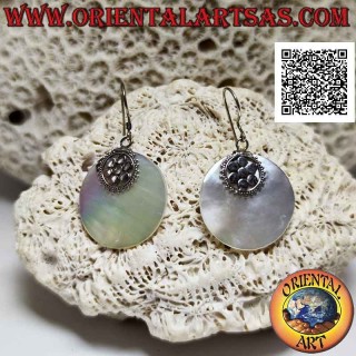 Silver earrings with flat round mother-of-pearl pendant attached to a six-petal flower
