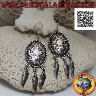 Silver leverback earrings with oval ethnic shield decorated in relief and hanging feathers