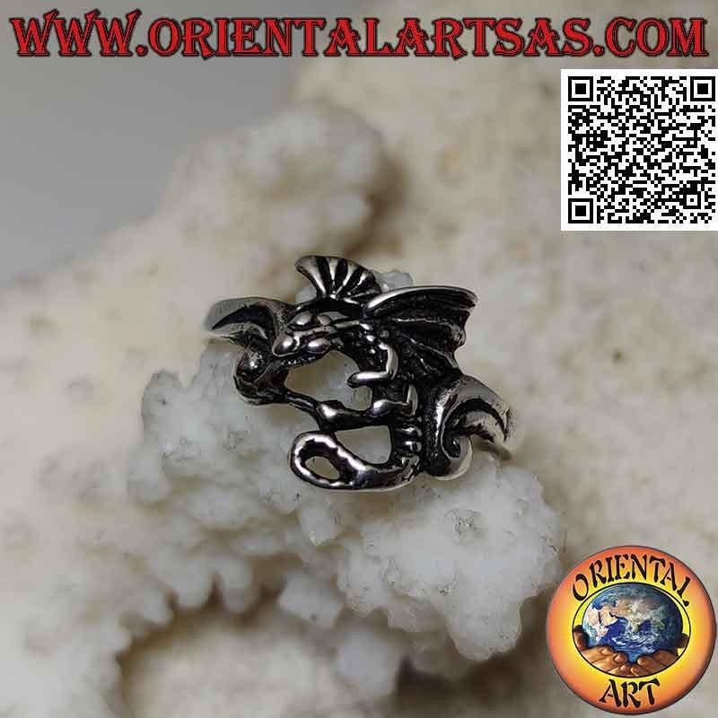 Silver ring with basilisk dragon in profile flight