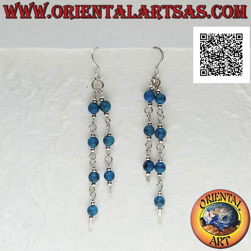 Silver earrings with a pair of dangling threads with turquoise and silver balls