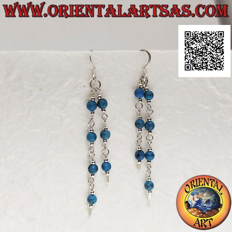 Silver earrings with a pair of dangling threads with turquoise and silver balls