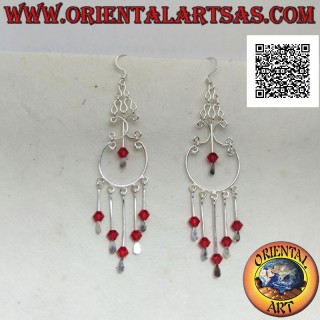 Baroque style silver hoop earrings with red crystals hanging in the center and below