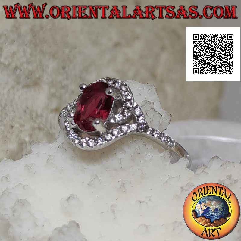 Bague en argent avec rubis synthétique ovale enveloppé dans une spirale de zircon