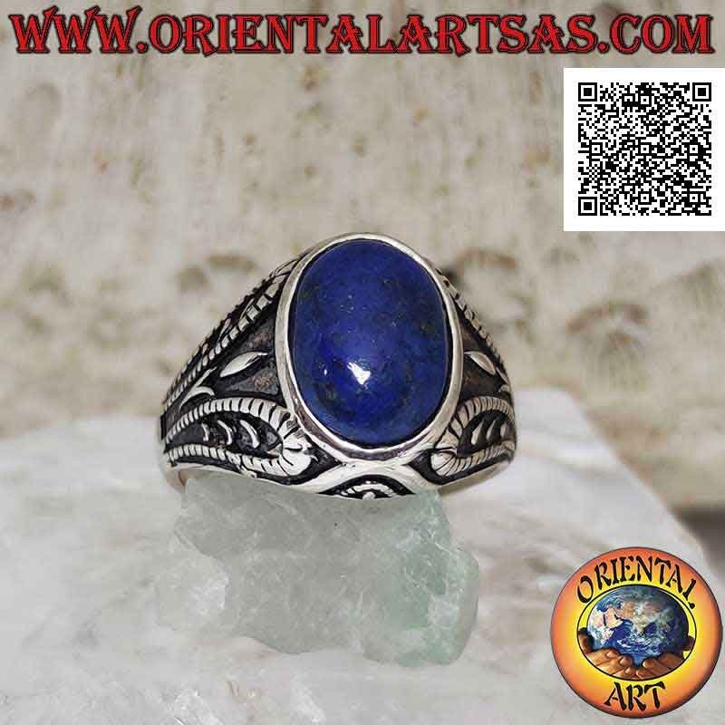 Silver ring with oval cabochon lapis lazuli and symmetrical decoration in bas-relief on the sides