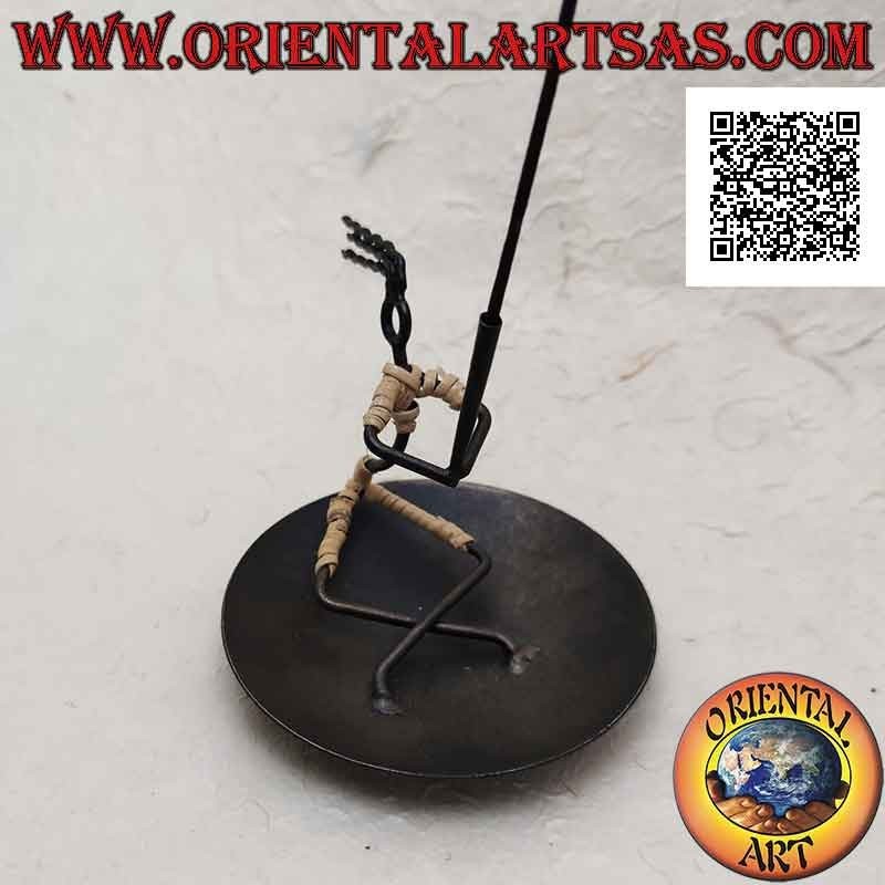 Round wrought iron incense burner, sitting man holding the torch