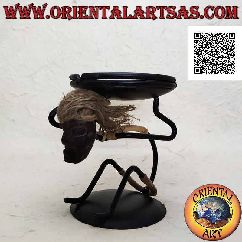 Wrought iron ashtray, primitive man sitting with saucer on his shoulders