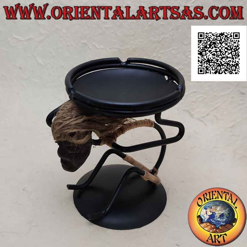 Wrought iron ashtray, primitive man sitting with saucer on his shoulders