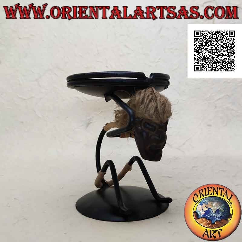 Wrought iron ashtray, primitive man sitting with saucer on his shoulders