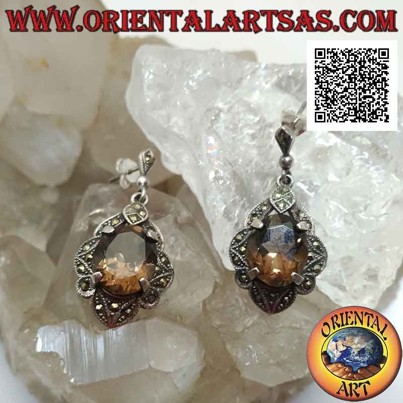 Silver earrings with faceted oval smoky topaz set on a frame studded with marcasite