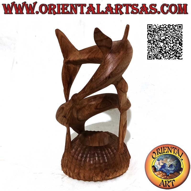 Sculpture of a pair of dolphins in a helical game with a ball between the snouts in 22 cm American pine wood
